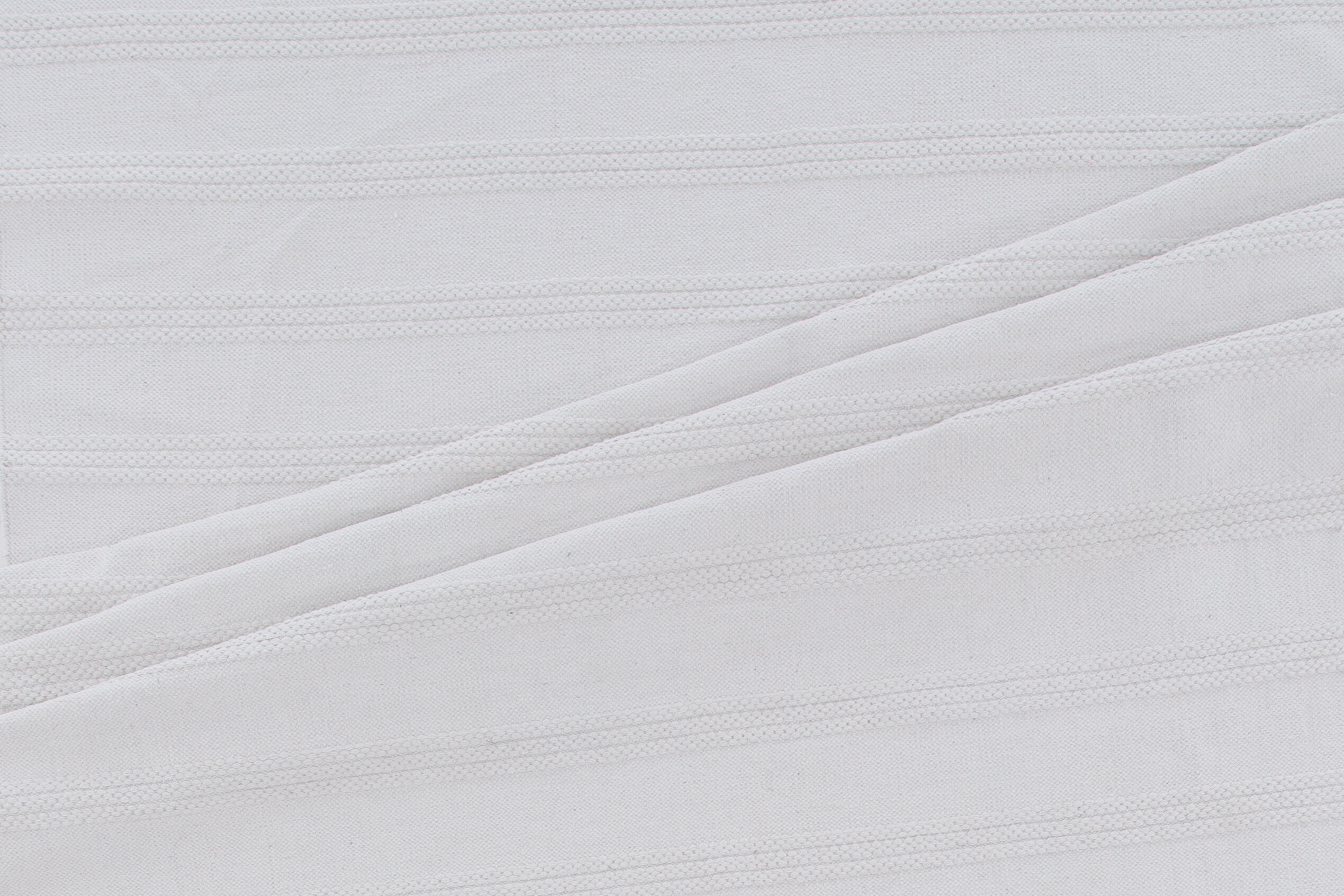 Détail du tapis de salon Nico blanc cassé 230 x 160 cm