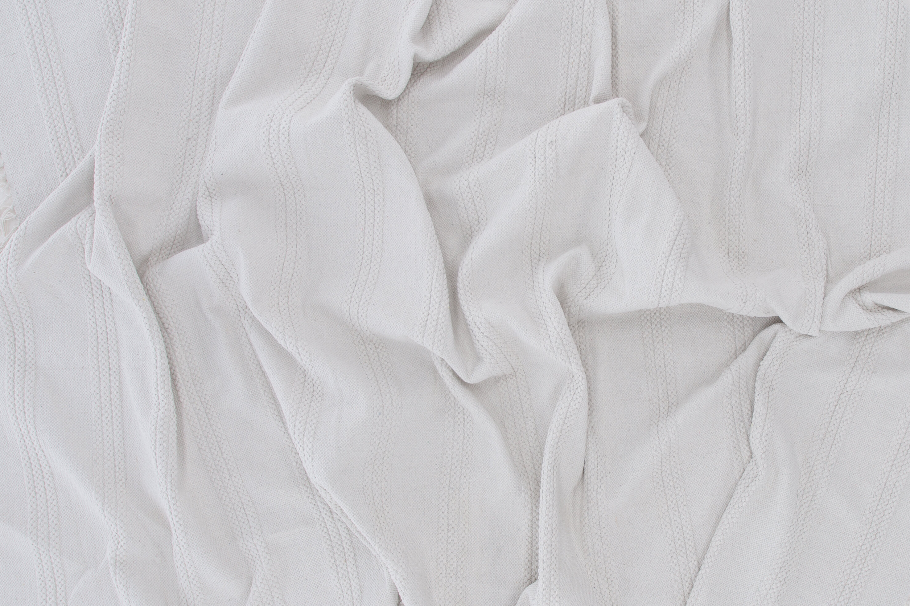 Détail du tapis de salon Nico blanc cassé 230 x 160 cm